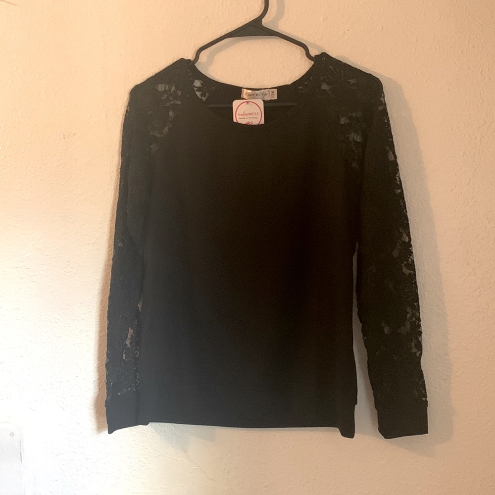 Size medium black top. New with tags.